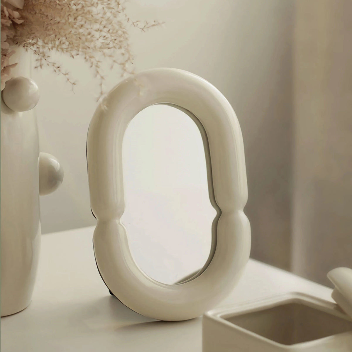 Elegant Oval Mirror with Sculptural Shape