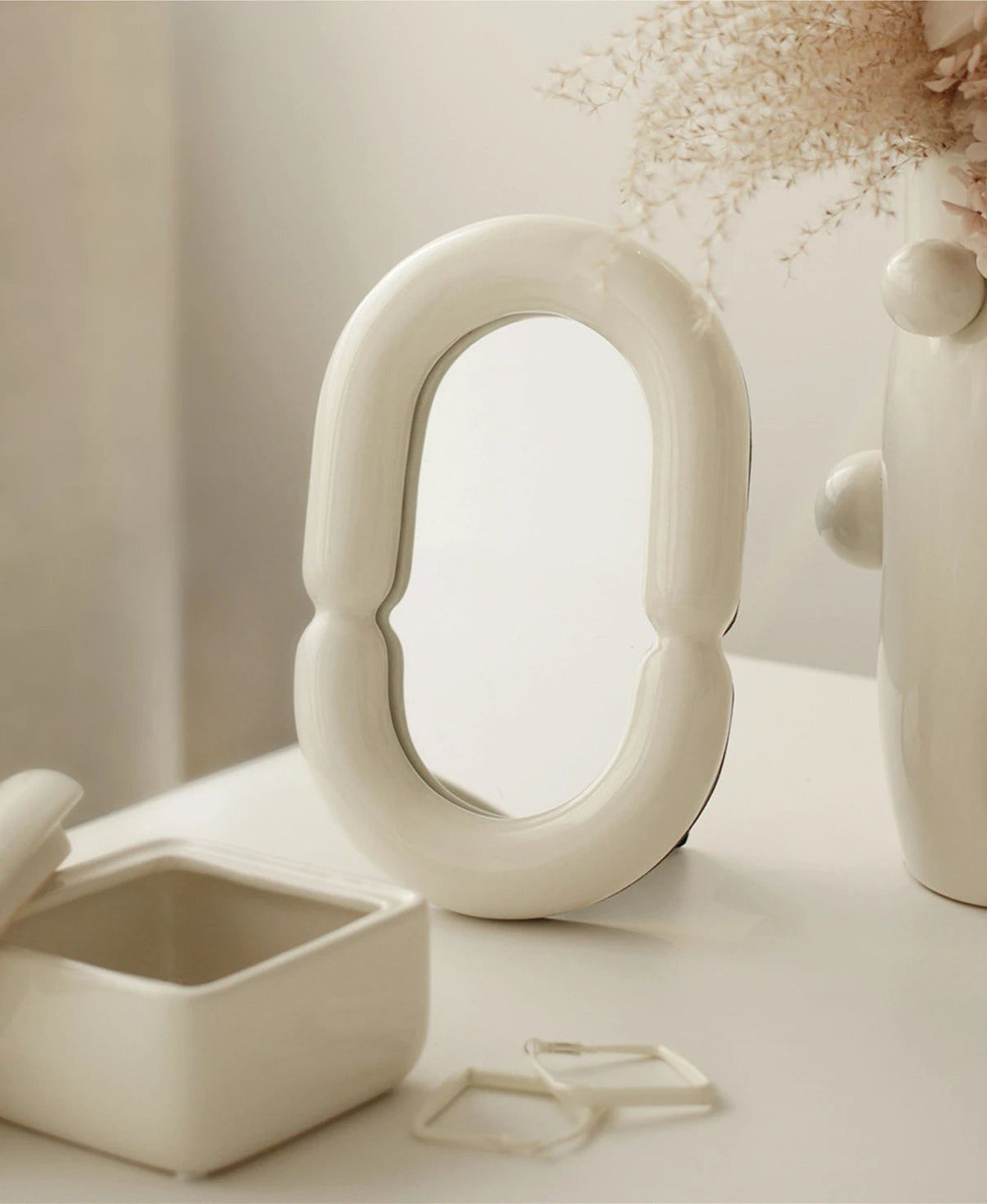 Elegant Oval Mirror with Sculptural Shape