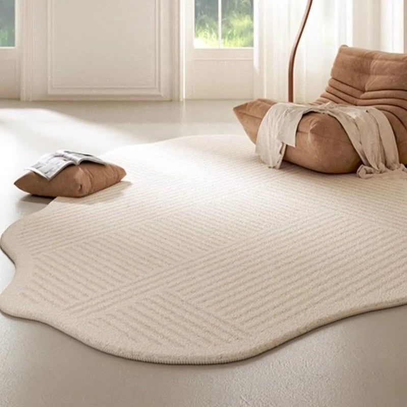 Irregular Area Rug with Textured Geometric Pattern and Whipstitched Edges