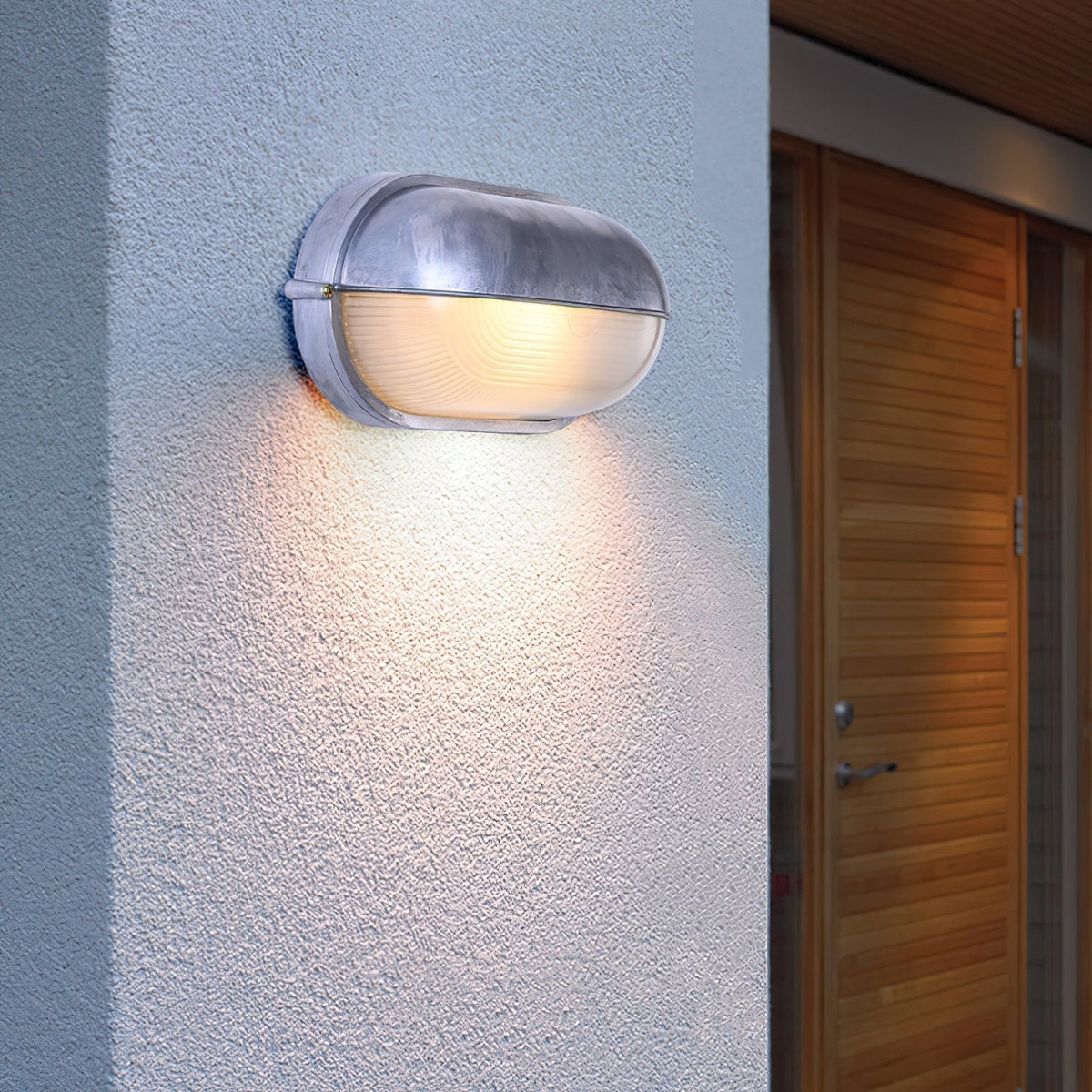 Outdoor Bulkhead Wall Light with Oval Shield and Ribbed Glass Diffuser
