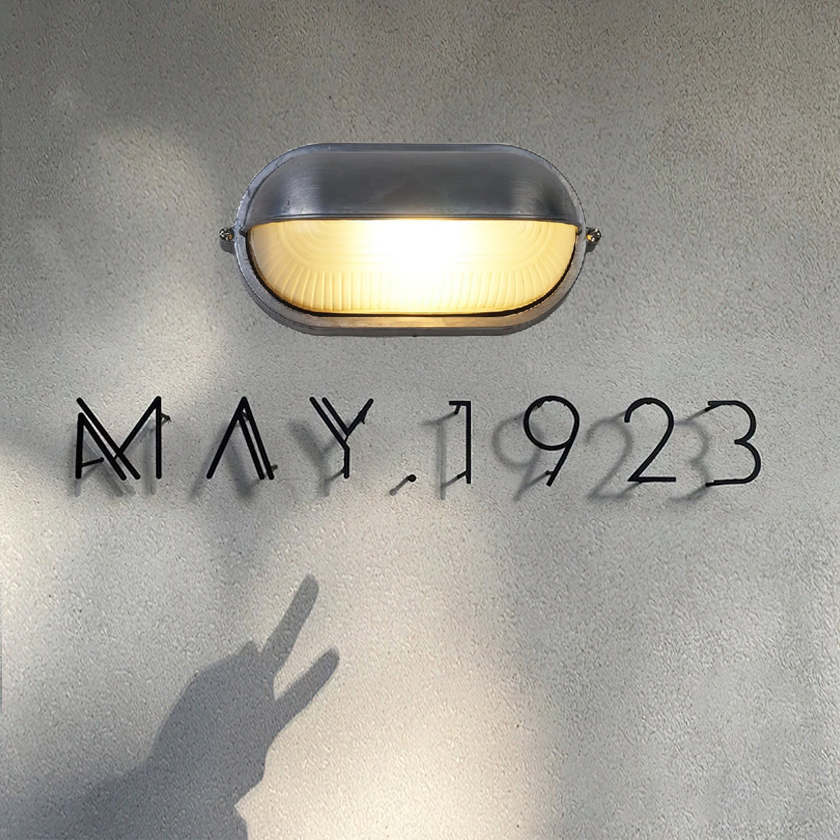 Outdoor Bulkhead Wall Light with Oval Shield and Ribbed Glass Diffuser