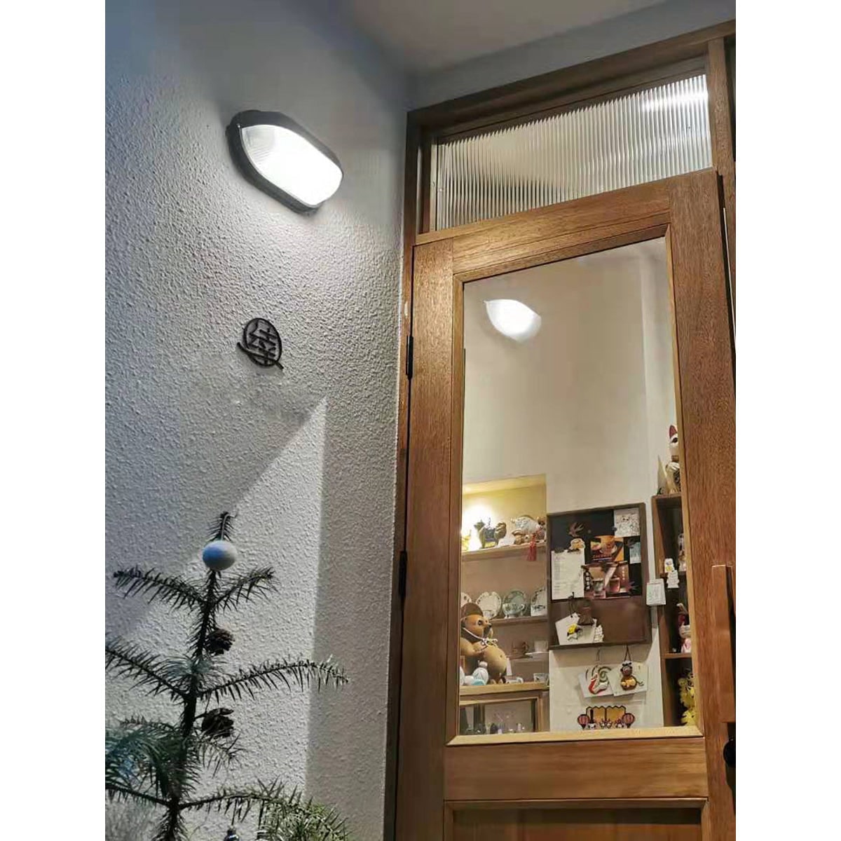 Outdoor Bulkhead Wall Light with Oval Shield and Ribbed Glass Diffuser