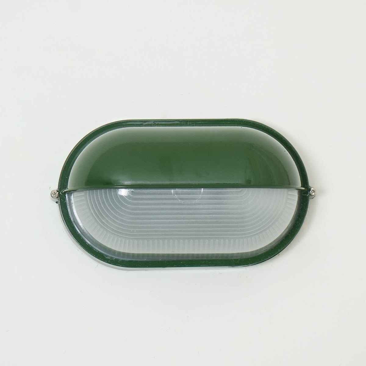 Outdoor Bulkhead Wall Light with Oval Shield and Ribbed Glass Diffuser