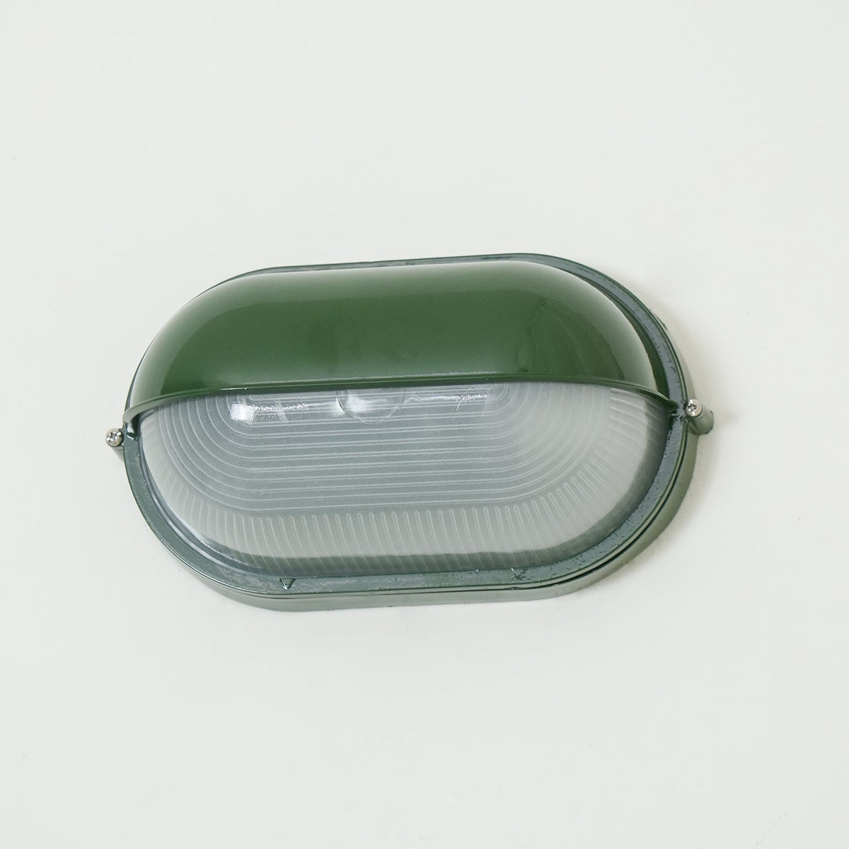 Outdoor Bulkhead Wall Light with Oval Shield and Ribbed Glass Diffuser