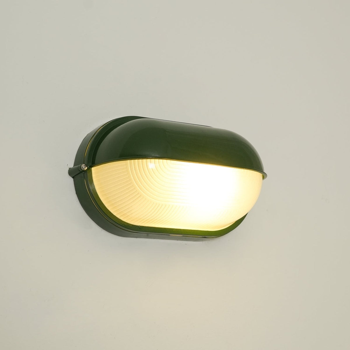 Outdoor Bulkhead Wall Light with Oval Shield and Ribbed Glass Diffuser