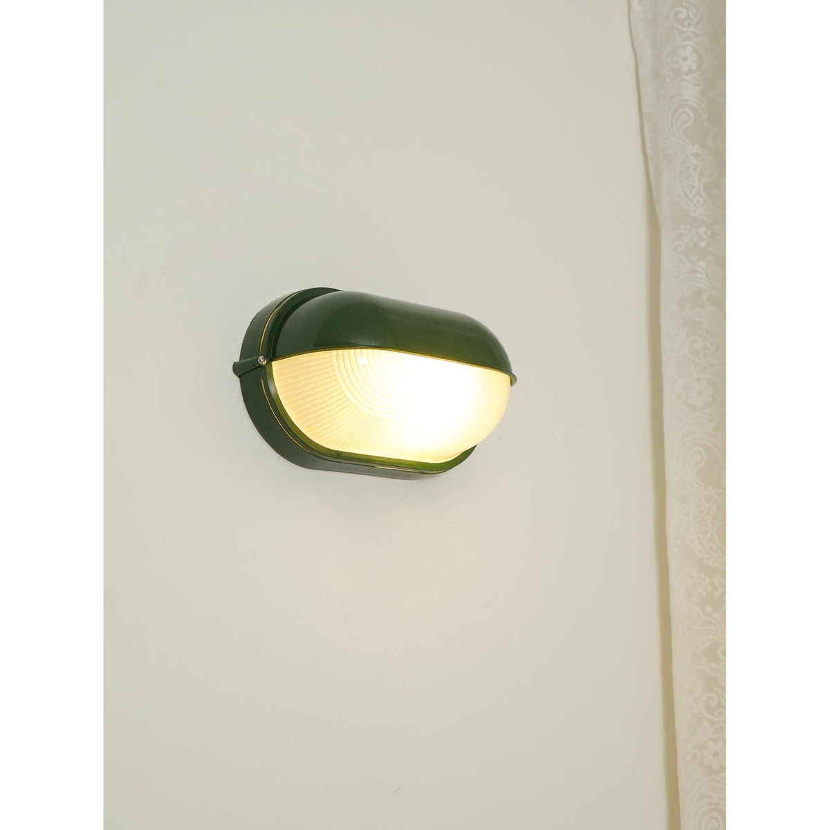 Outdoor Bulkhead Wall Light with Oval Shield and Ribbed Glass Diffuser
