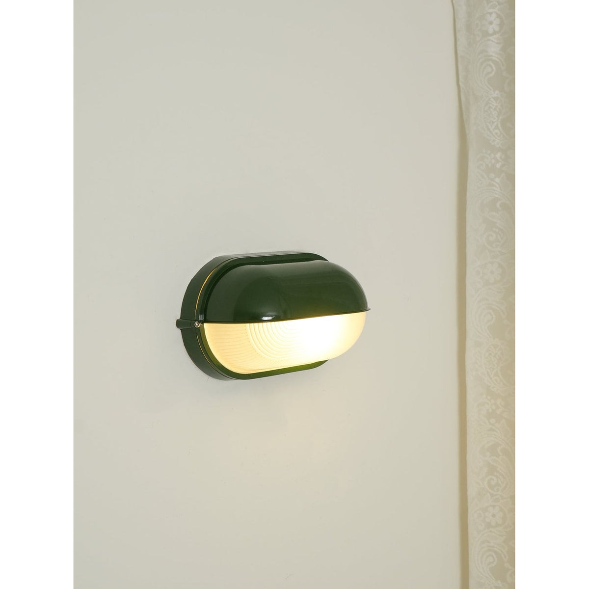 Outdoor Bulkhead Wall Light with Oval Shield and Ribbed Glass Diffuser