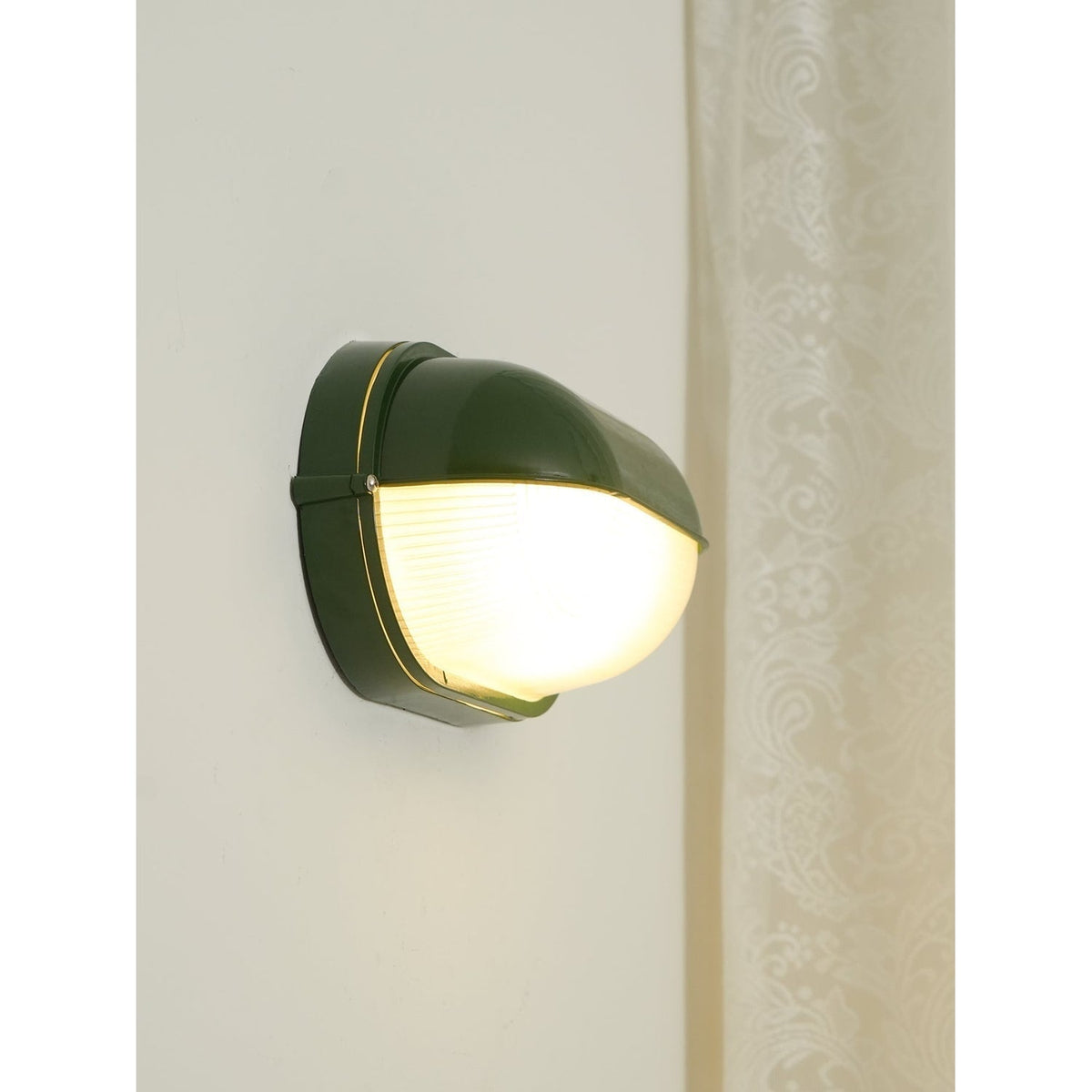 Outdoor Bulkhead Wall Light with Oval Shield and Ribbed Glass Diffuser