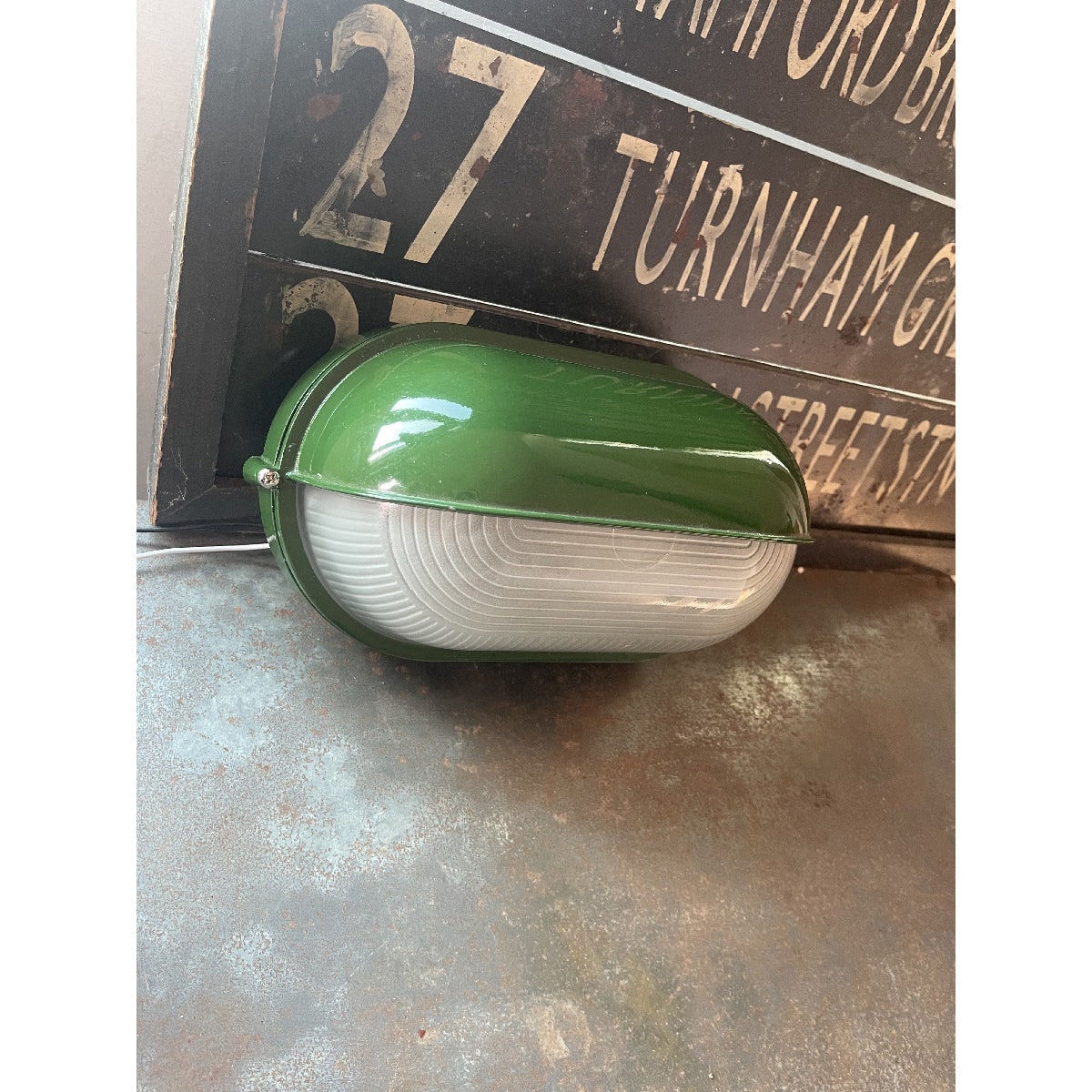 Outdoor Bulkhead Wall Light with Oval Shield and Ribbed Glass Diffuser