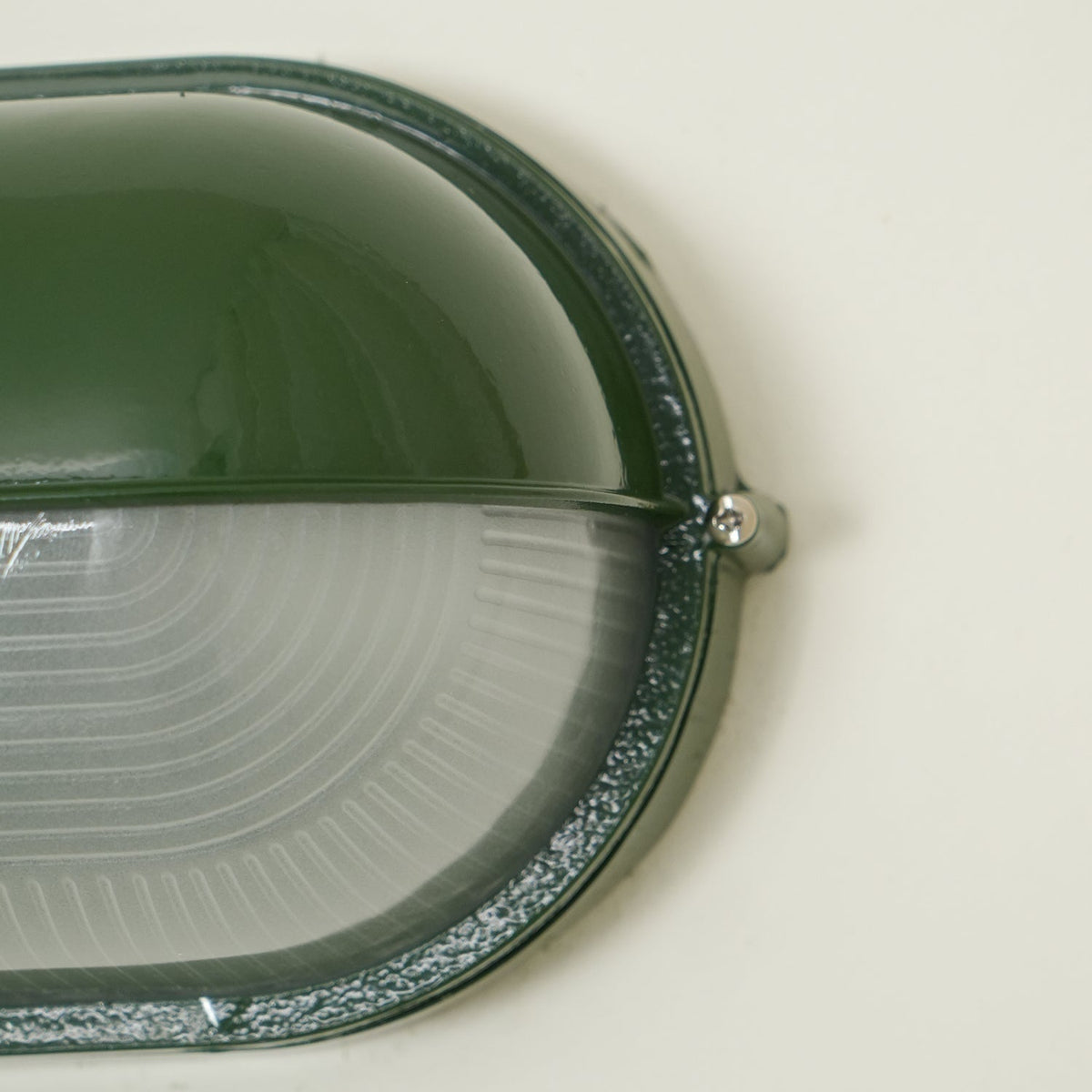Outdoor Bulkhead Wall Light with Oval Shield and Ribbed Glass Diffuser
