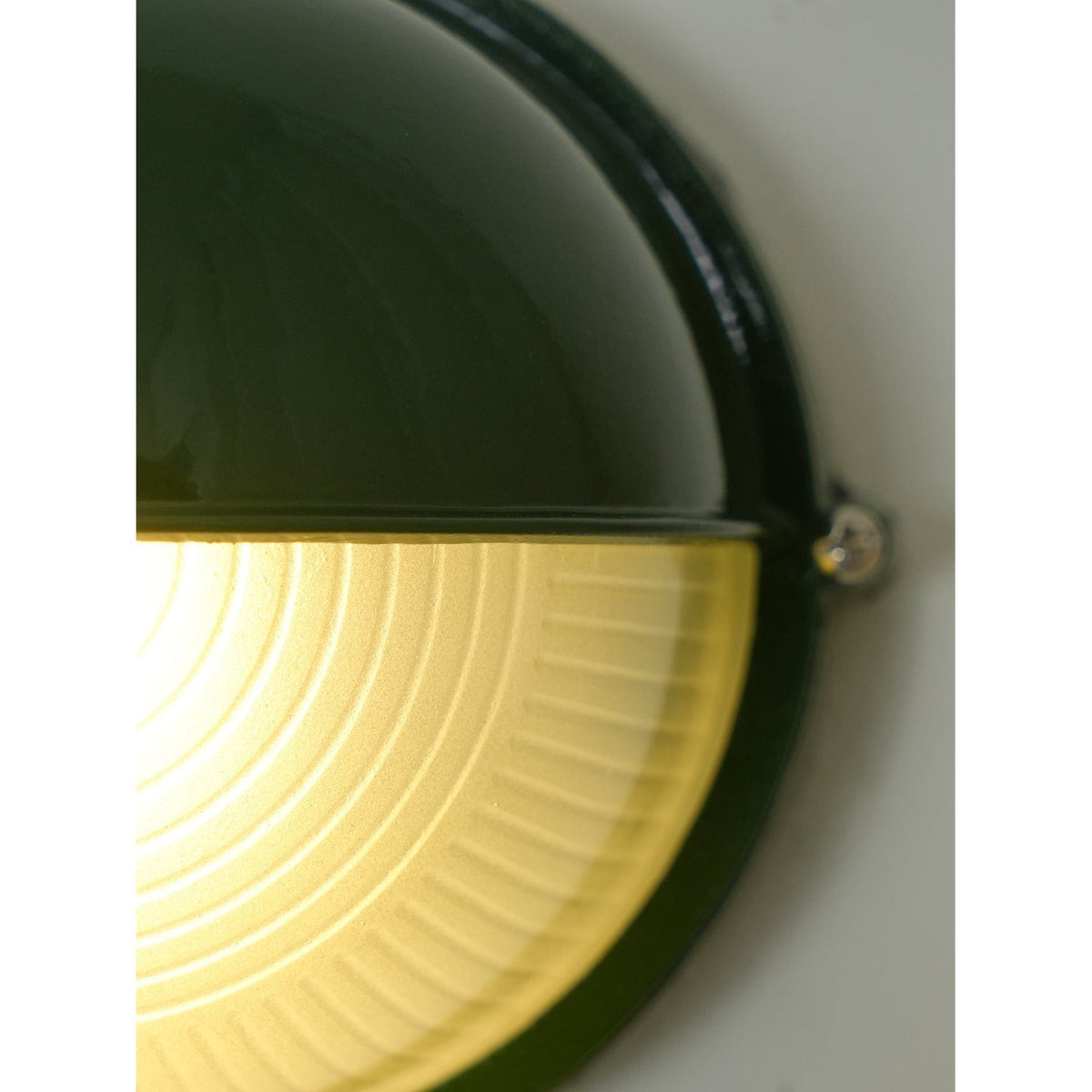 Outdoor Bulkhead Wall Light with Oval Shield and Ribbed Glass Diffuser
