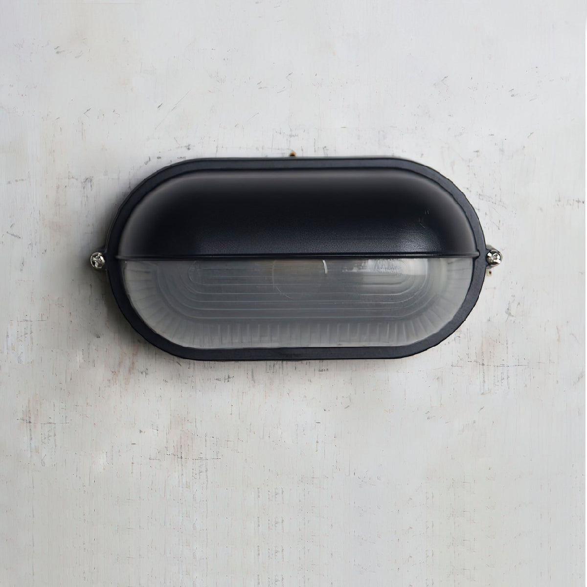Outdoor Bulkhead Wall Light with Oval Shield and Ribbed Glass Diffuser