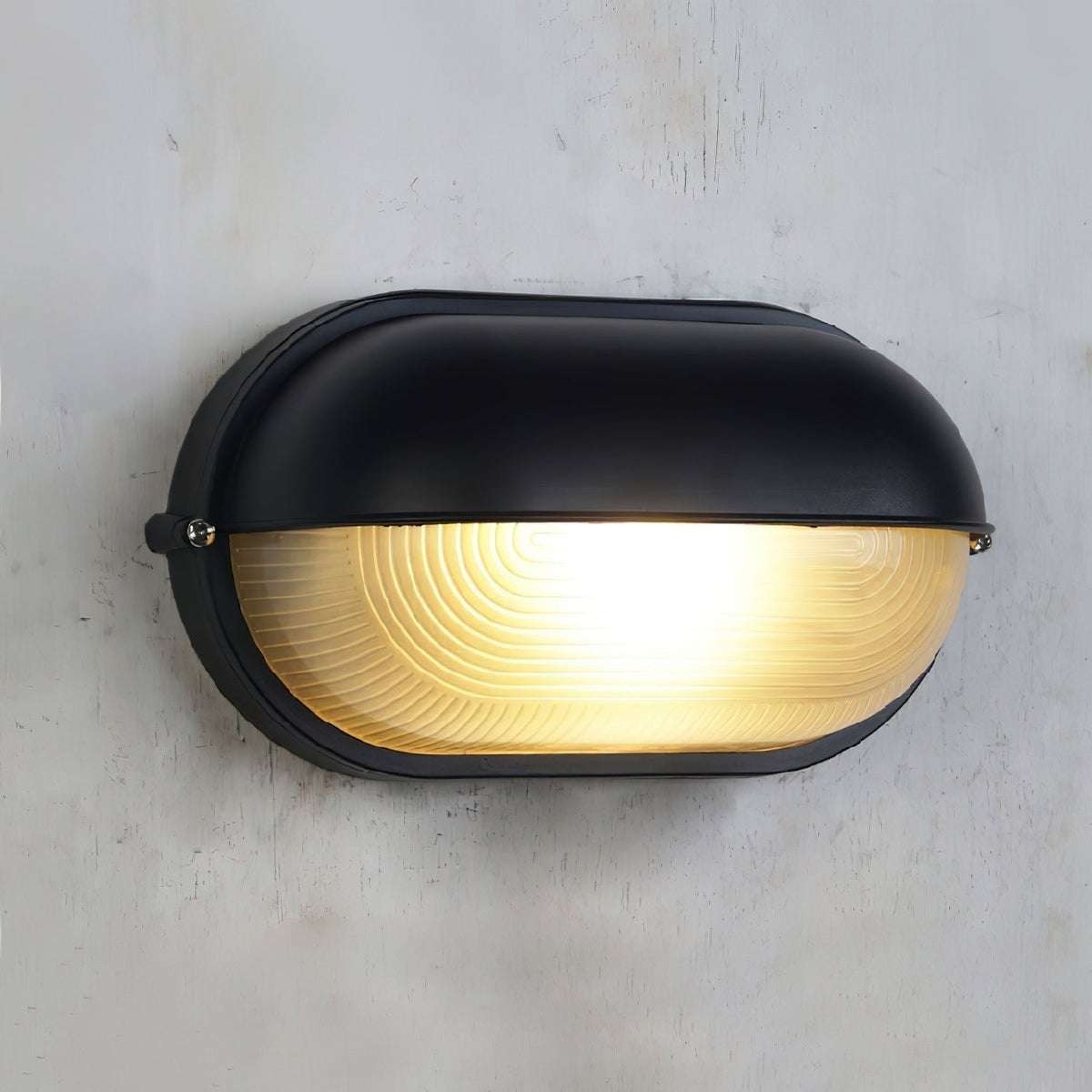 Outdoor Bulkhead Wall Light with Oval Shield and Ribbed Glass Diffuser