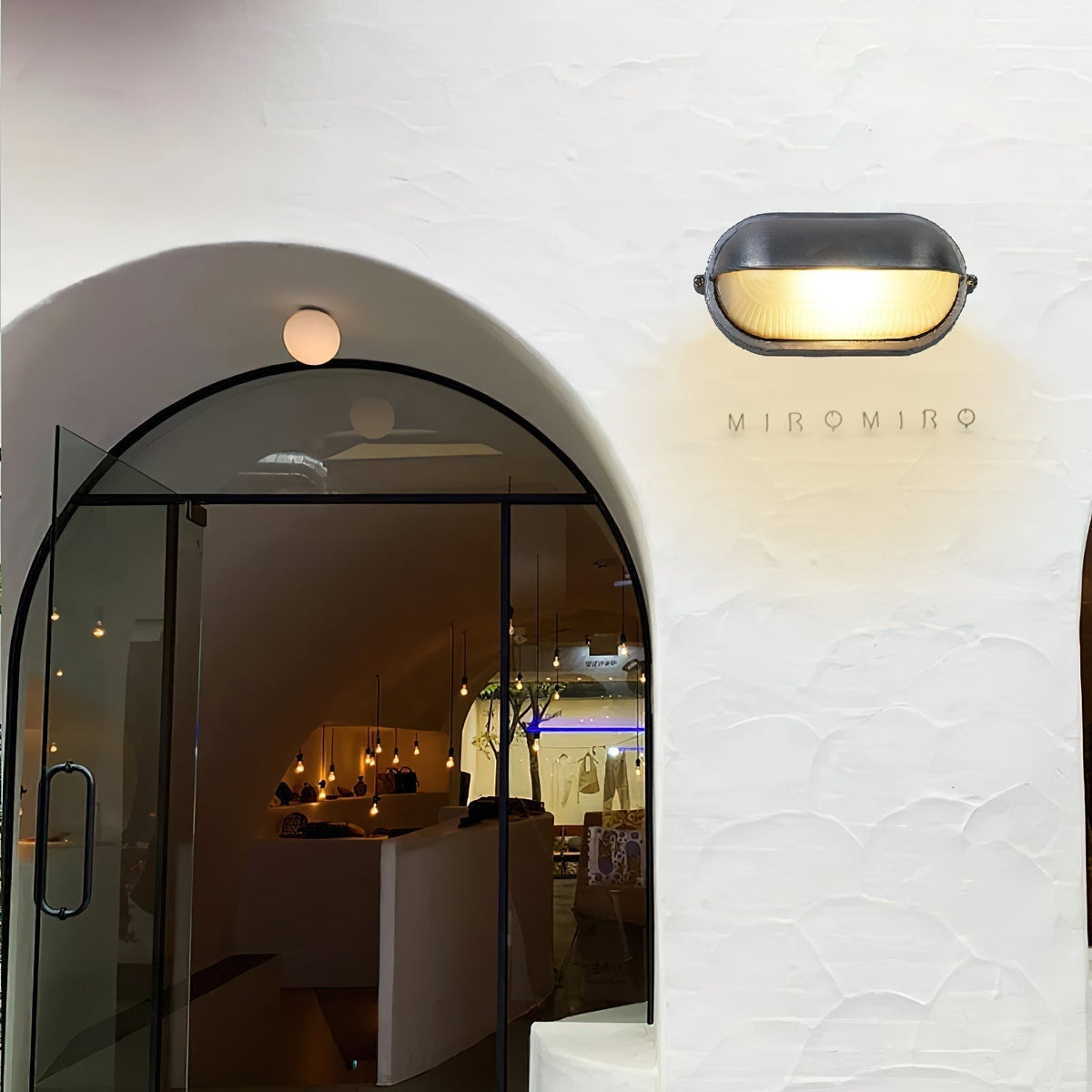 Outdoor Bulkhead Wall Light with Oval Shield and Ribbed Glass Diffuser