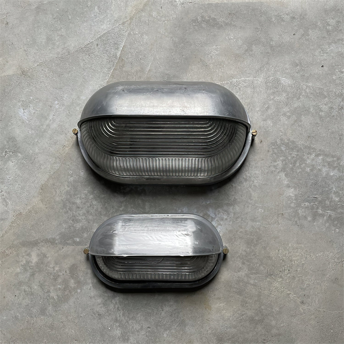 Outdoor Bulkhead Wall Light with Oval Shield and Ribbed Glass Diffuser