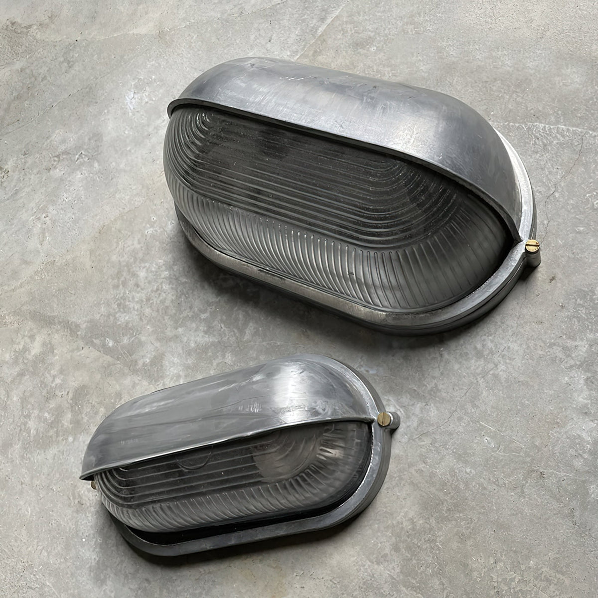 Outdoor Bulkhead Wall Light with Oval Shield and Ribbed Glass Diffuser