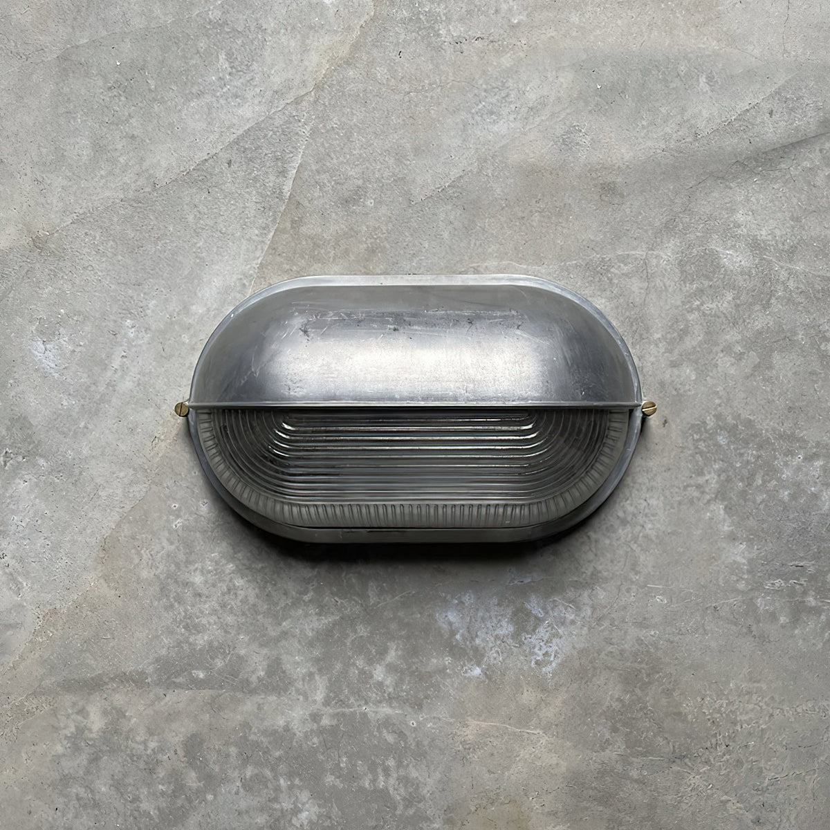 Outdoor Bulkhead Wall Light with Oval Shield and Ribbed Glass Diffuser