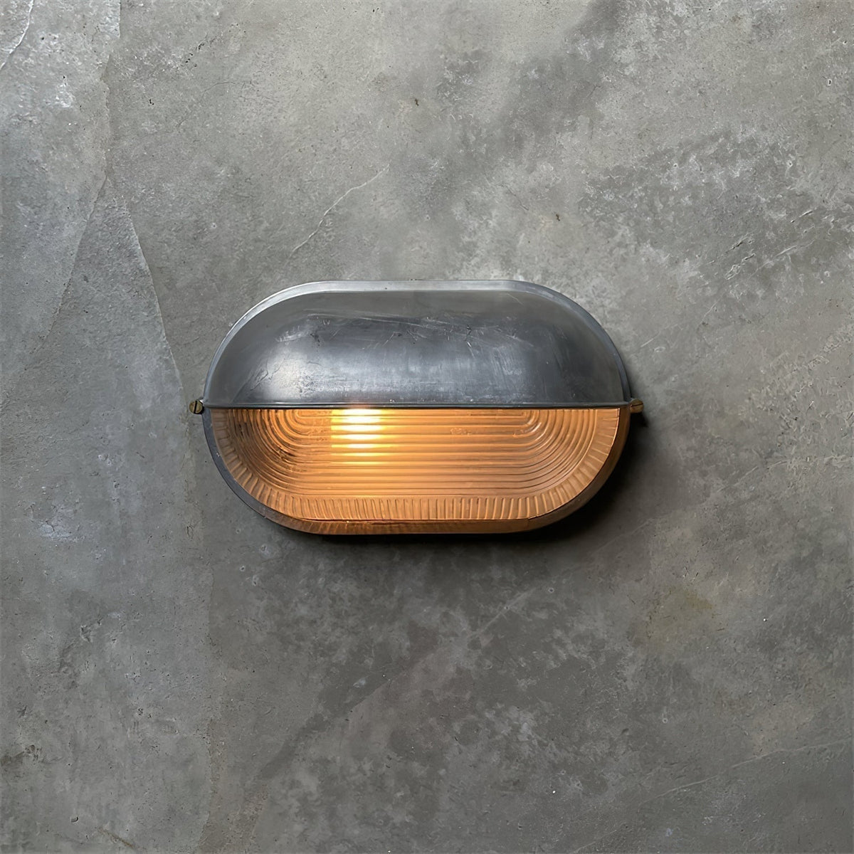 Outdoor Bulkhead Wall Light with Oval Shield and Ribbed Glass Diffuser