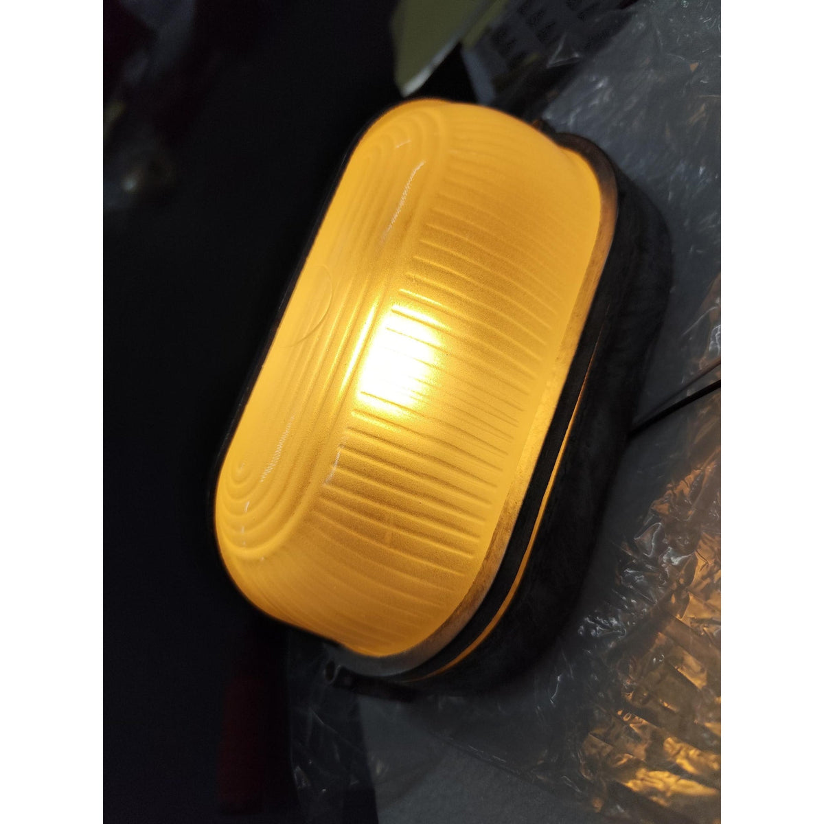 Outdoor Bulkhead Wall Light with Oval Shield and Ribbed Glass Diffuser