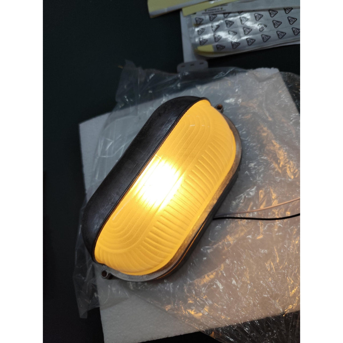 Outdoor Bulkhead Wall Light with Oval Shield and Ribbed Glass Diffuser