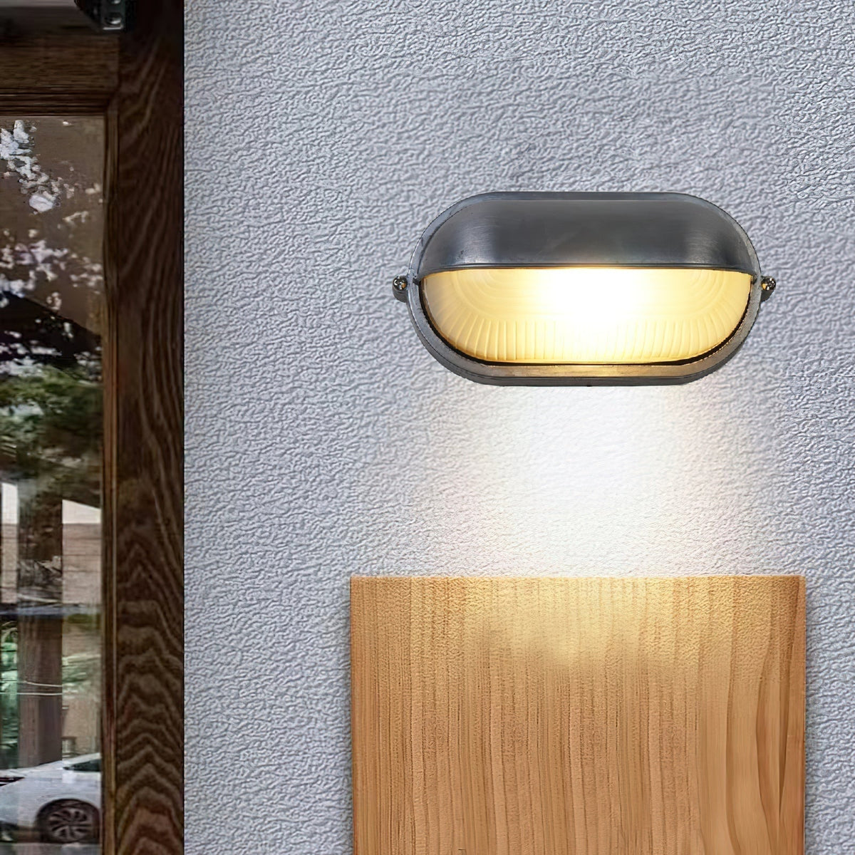 Outdoor Bulkhead Wall Light with Oval Shield and Ribbed Glass Diffuser