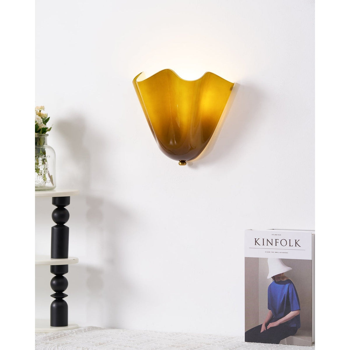 Wall Sconce with Wavy Glass Shade and Warm Ambient Lighting