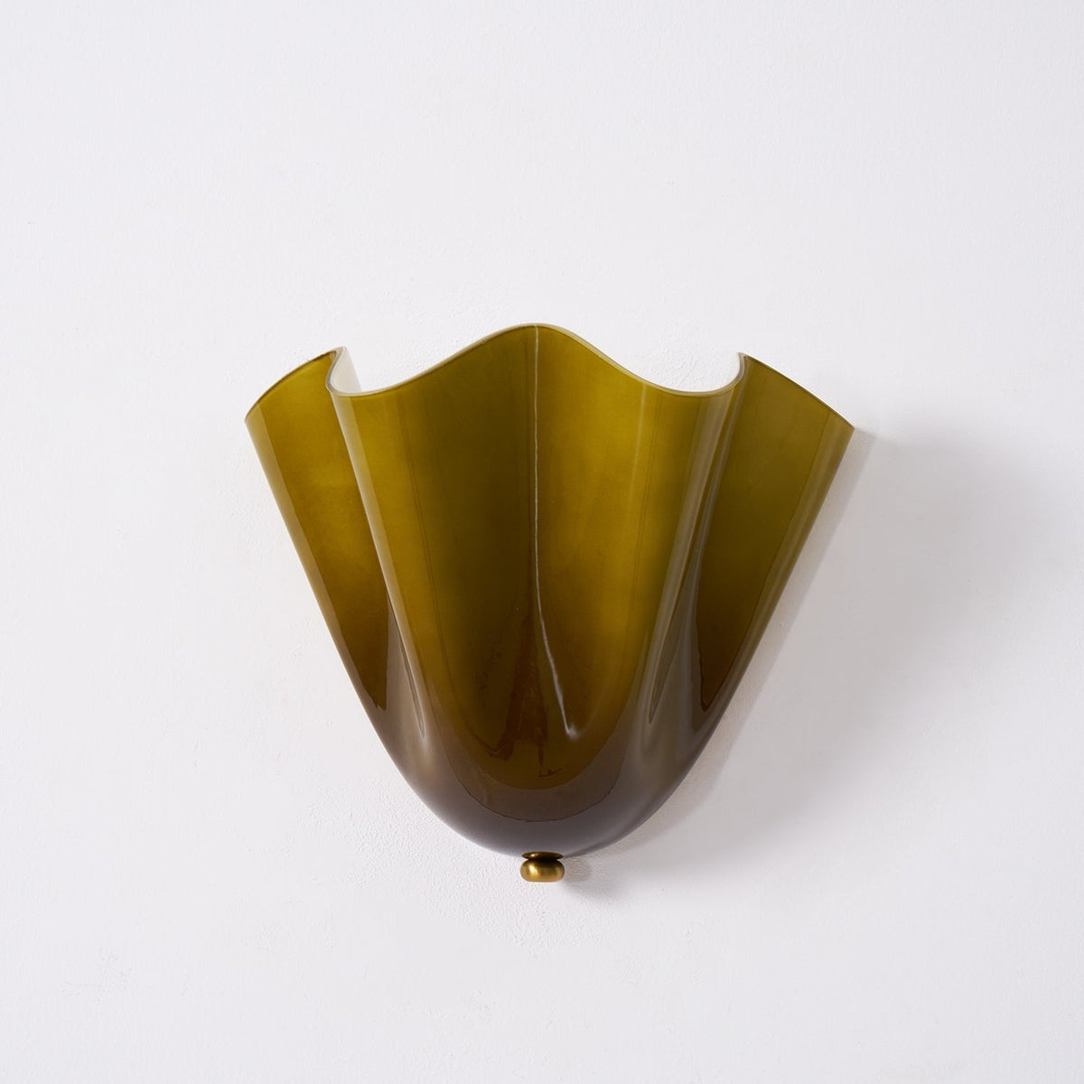 Wall Sconce with Wavy Glass Shade and Warm Ambient Lighting