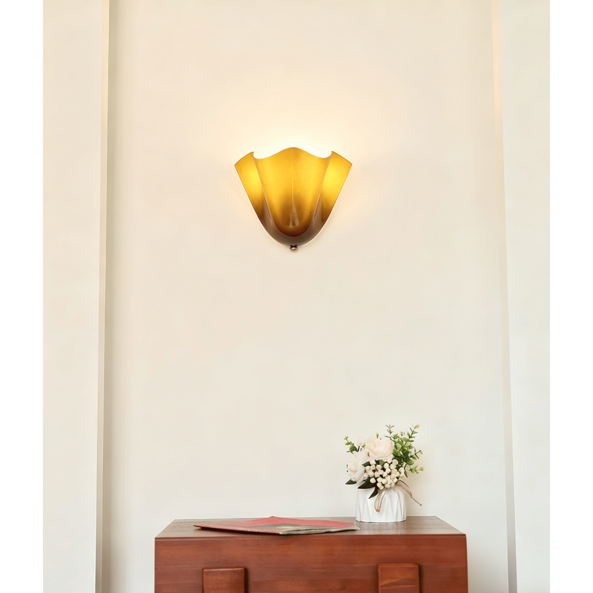 Wall Sconce with Wavy Glass Shade and Warm Ambient Lighting
