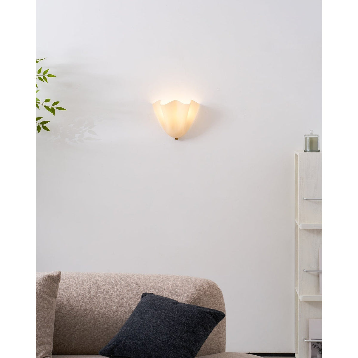 Wall Sconce with Wavy Glass Shade and Warm Ambient Lighting