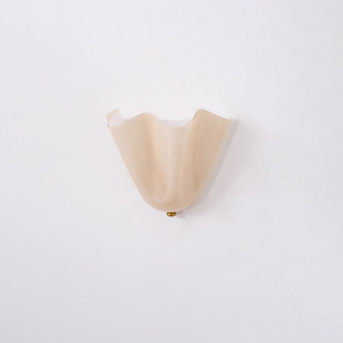 Wall Sconce with Wavy Glass Shade and Warm Ambient Lighting