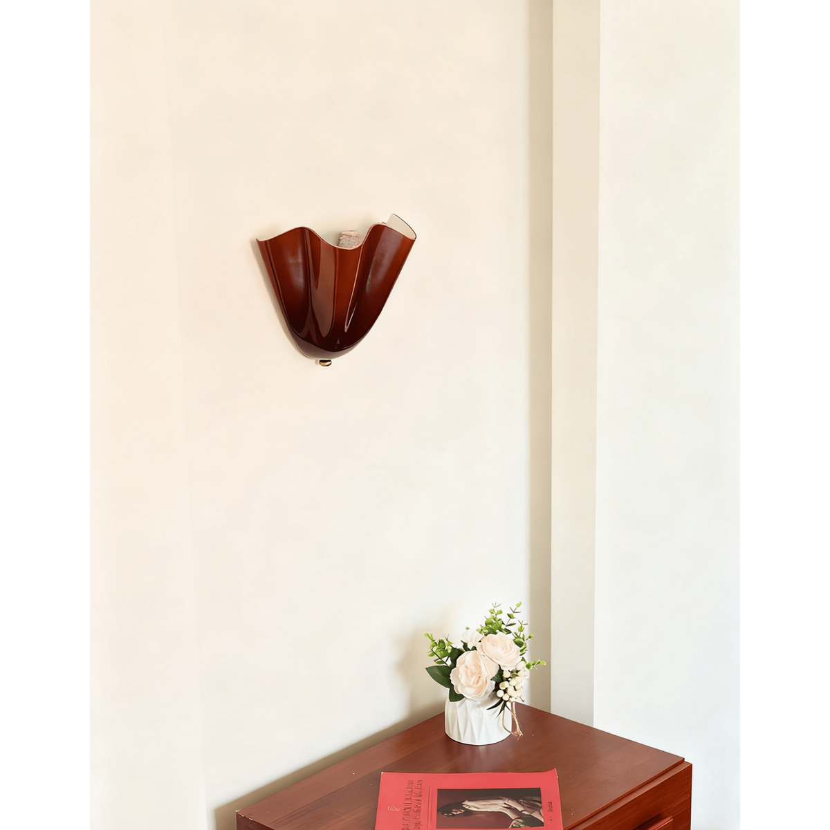 Wall Sconce with Wavy Glass Shade and Warm Ambient Lighting